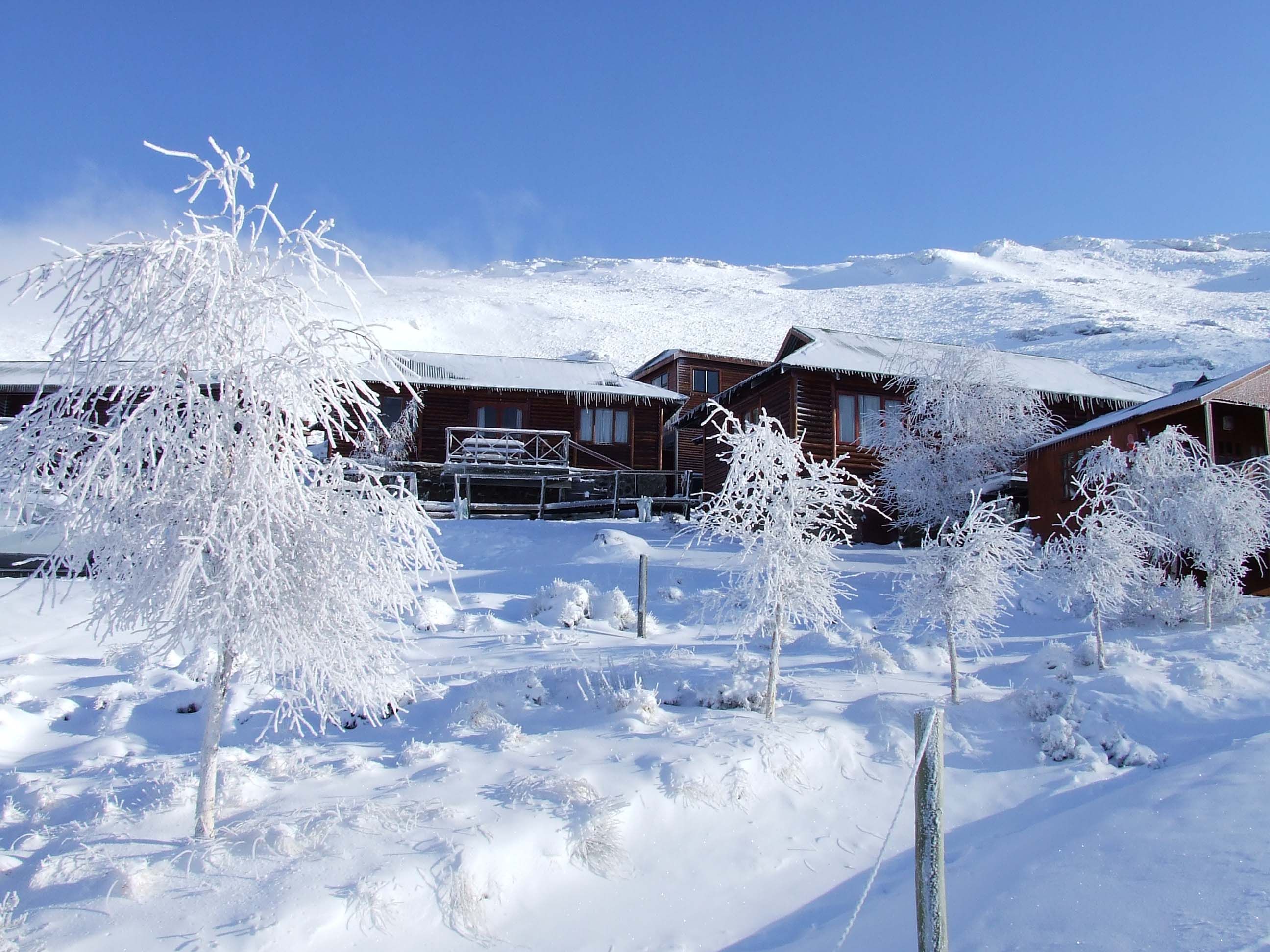 A snowy scene with a ski chalet in South Africa