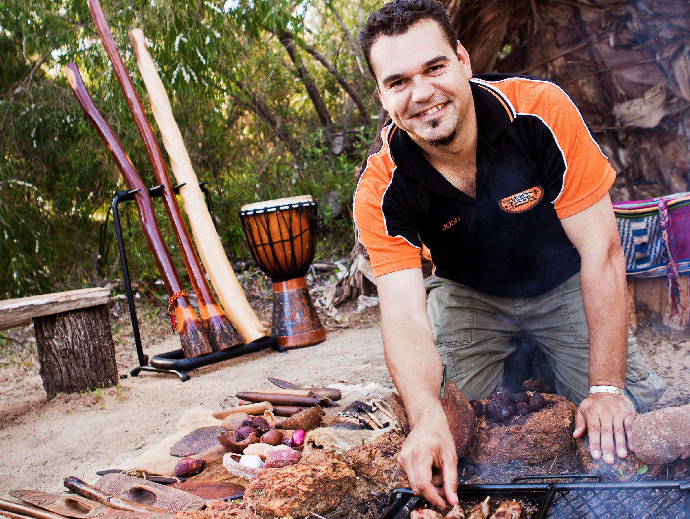 Chef Josh Whiteland grills outdoors