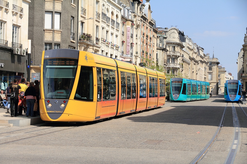Colourful trams travel through the city of Reims